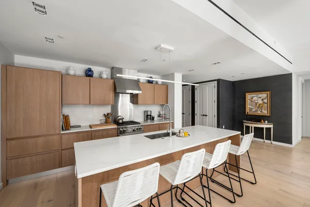 a living room with furniture a flat screen tv and a large window
