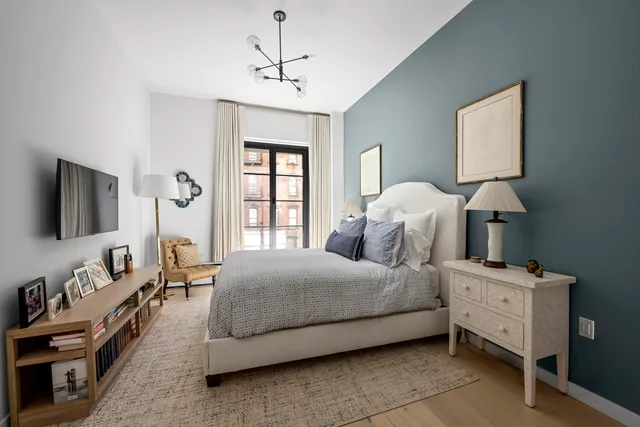 a kitchen with a table chairs and a refrigerator