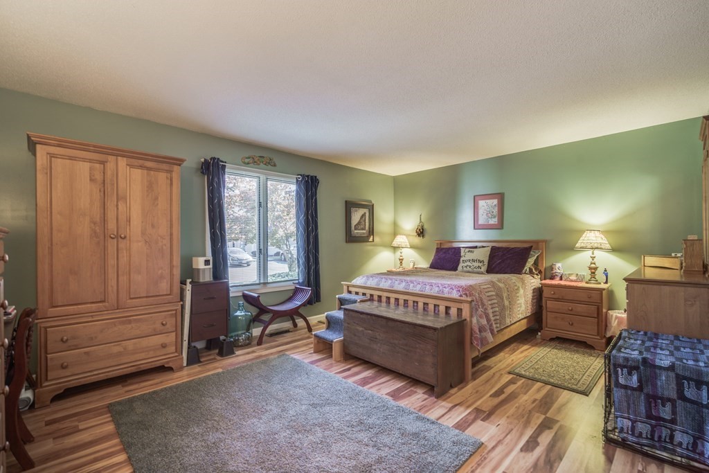 610 County Road, Unit 5 Holyoke, MA 01040 - Photo 13 of 33 a bedroom with a large bed and windows
