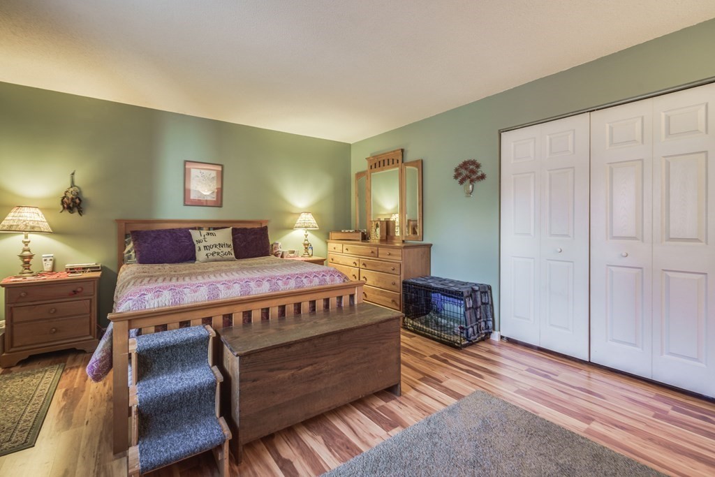 610 County Road, Unit 5 Holyoke, MA 01040 - Photo 15 of 33 a bedroom with a bed and wooden floor