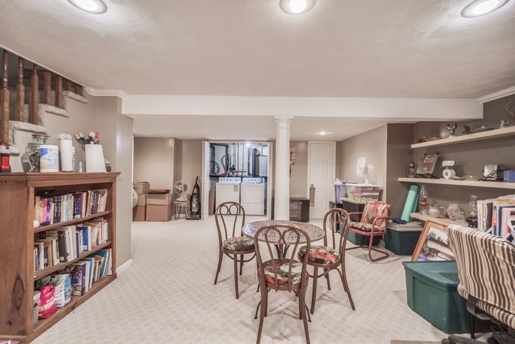 610 County Road, Unit 5 Holyoke, MA 01040 - Photo 22 of 33 a view of a livingroom with furniture and bookshelf