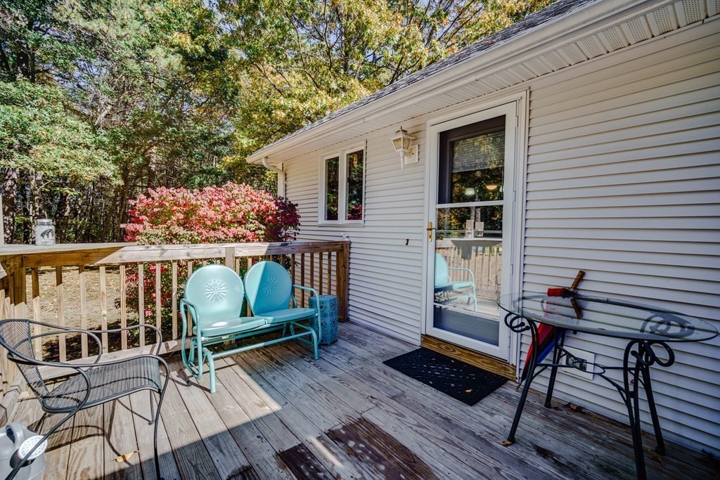 610 County Road, Unit 5 Holyoke, MA 01040 - Photo 27 of 33 a balcony with wooden floor table and chairs