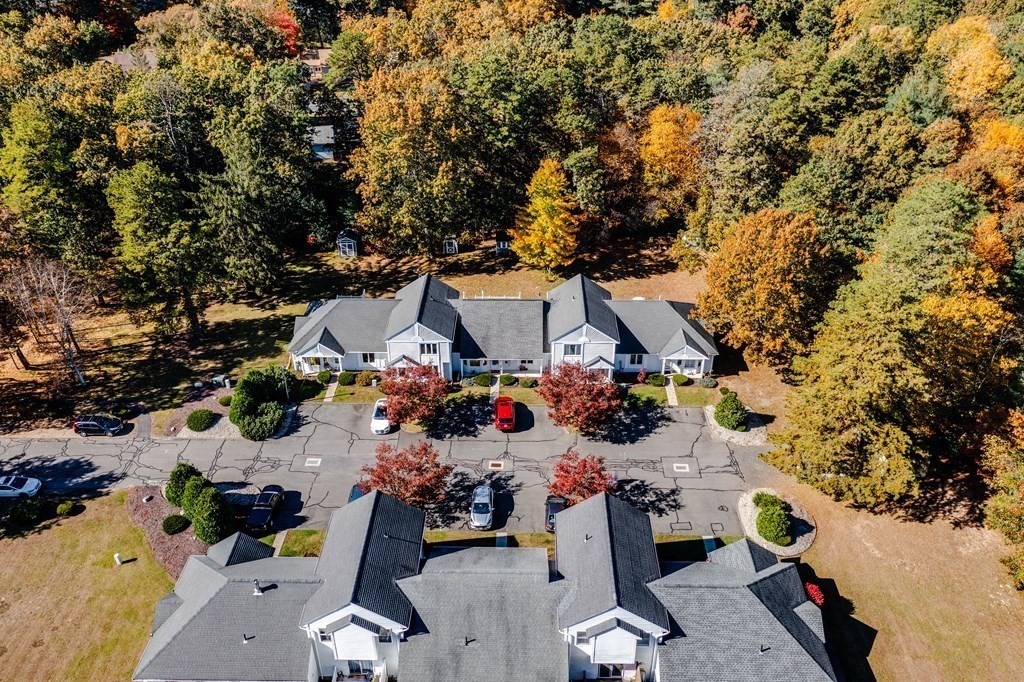 610 County Road, Unit 5 Holyoke, MA 01040 - Photo 4 of 33 an aerial view of a house with a yard and seating space
