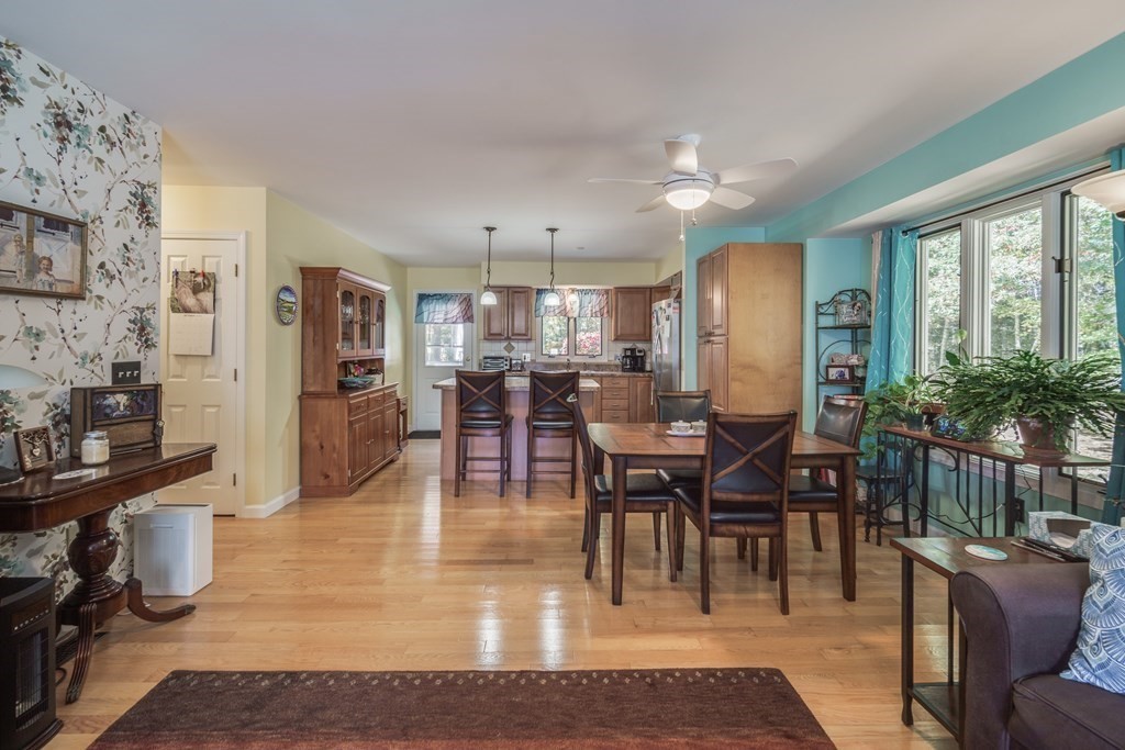 610 County Road, Unit 5 Holyoke, MA 01040 - Photo 9 of 33 a view of a dining area with furniture window and wooden floor