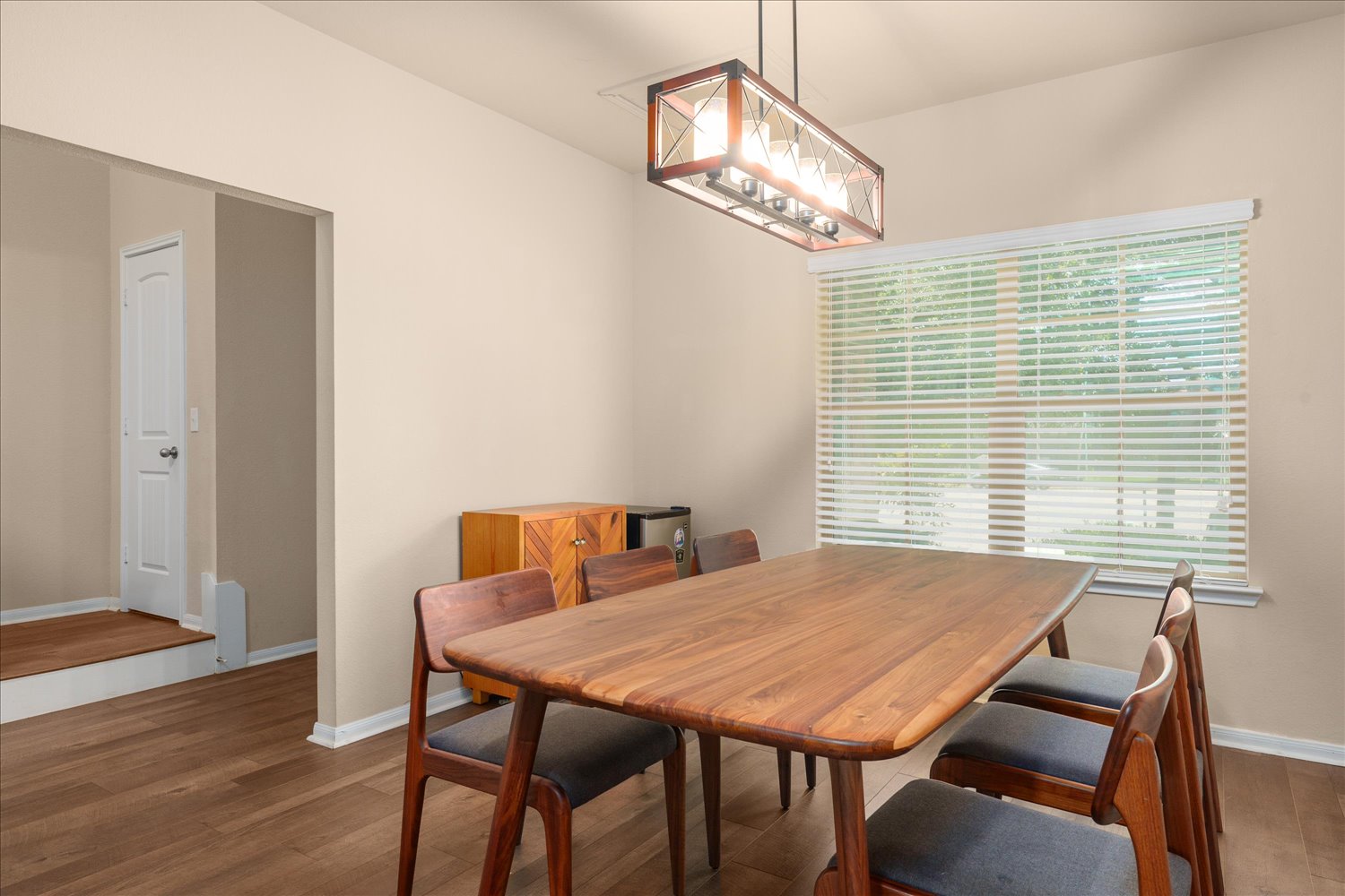 717 Kaluga Trail Leander, TX 78641 - Photo 14 of 40 a view of a dining room with furniture window and wooden floor