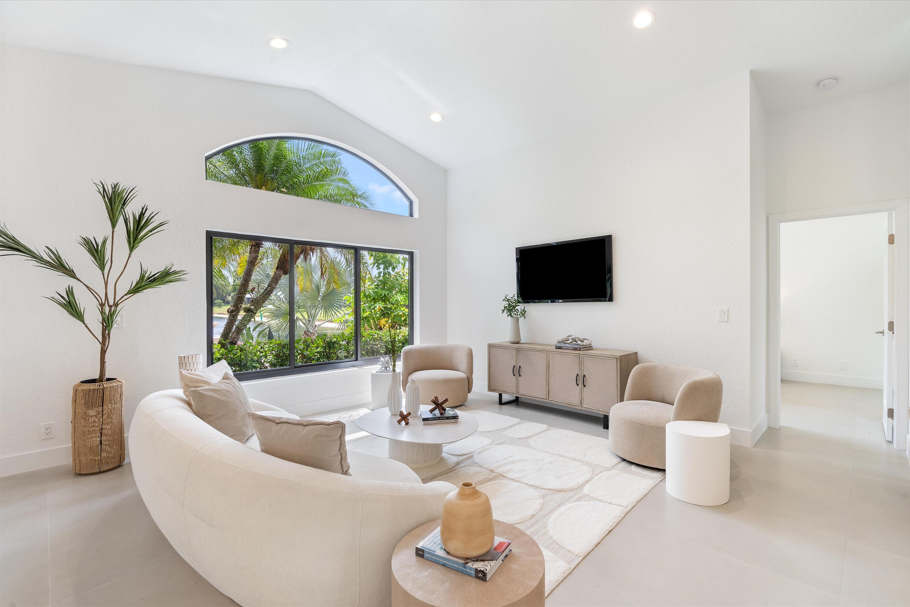 1175 Sea Grape Circle Delray Beach, FL 33445 - Photo 12 of 42 a living room with furniture and a flat screen tv