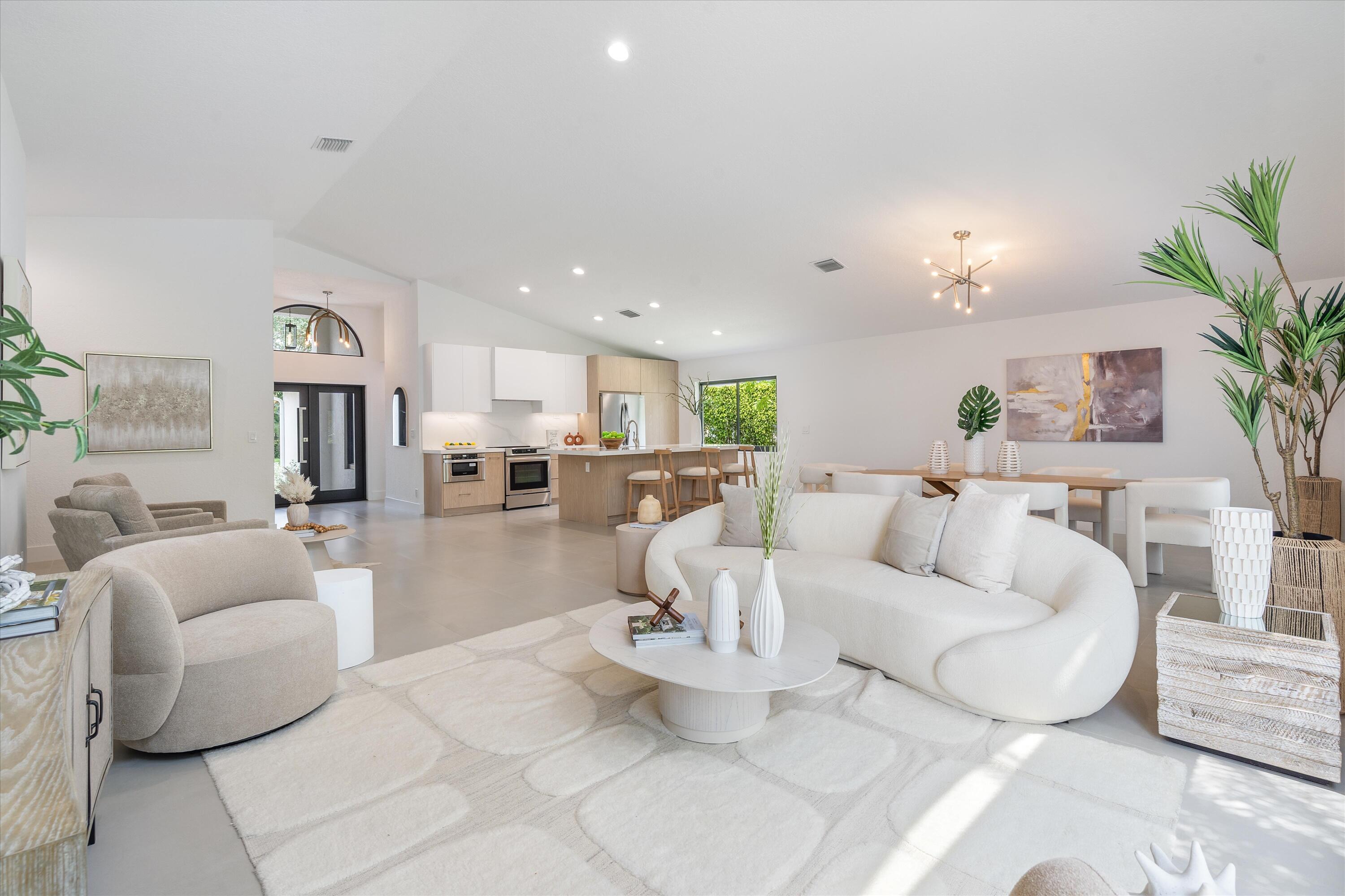 1175 Sea Grape Circle Delray Beach, FL 33445 - Photo 15 of 42 a living room with furniture and a view of kitchen