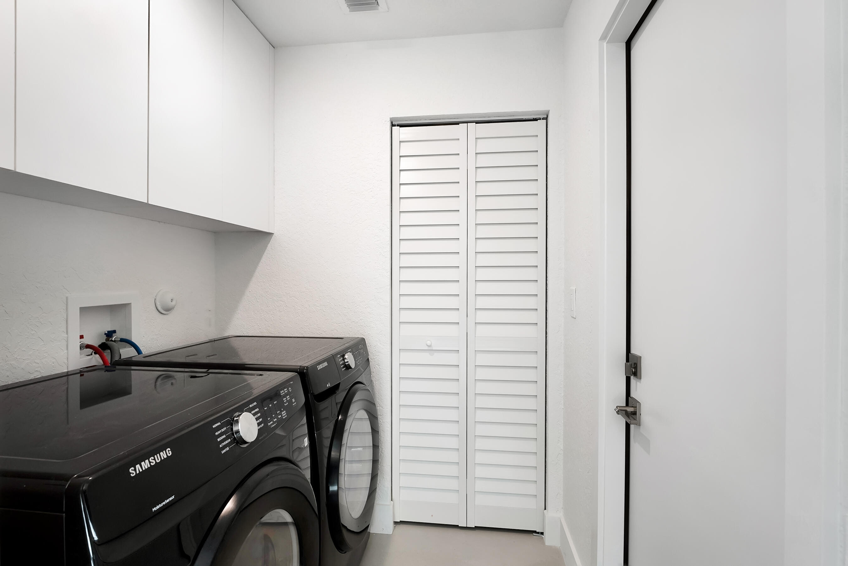 1175 Sea Grape Circle Delray Beach, FL 33445 - Photo 32 of 42 a utility room with dryer and washer