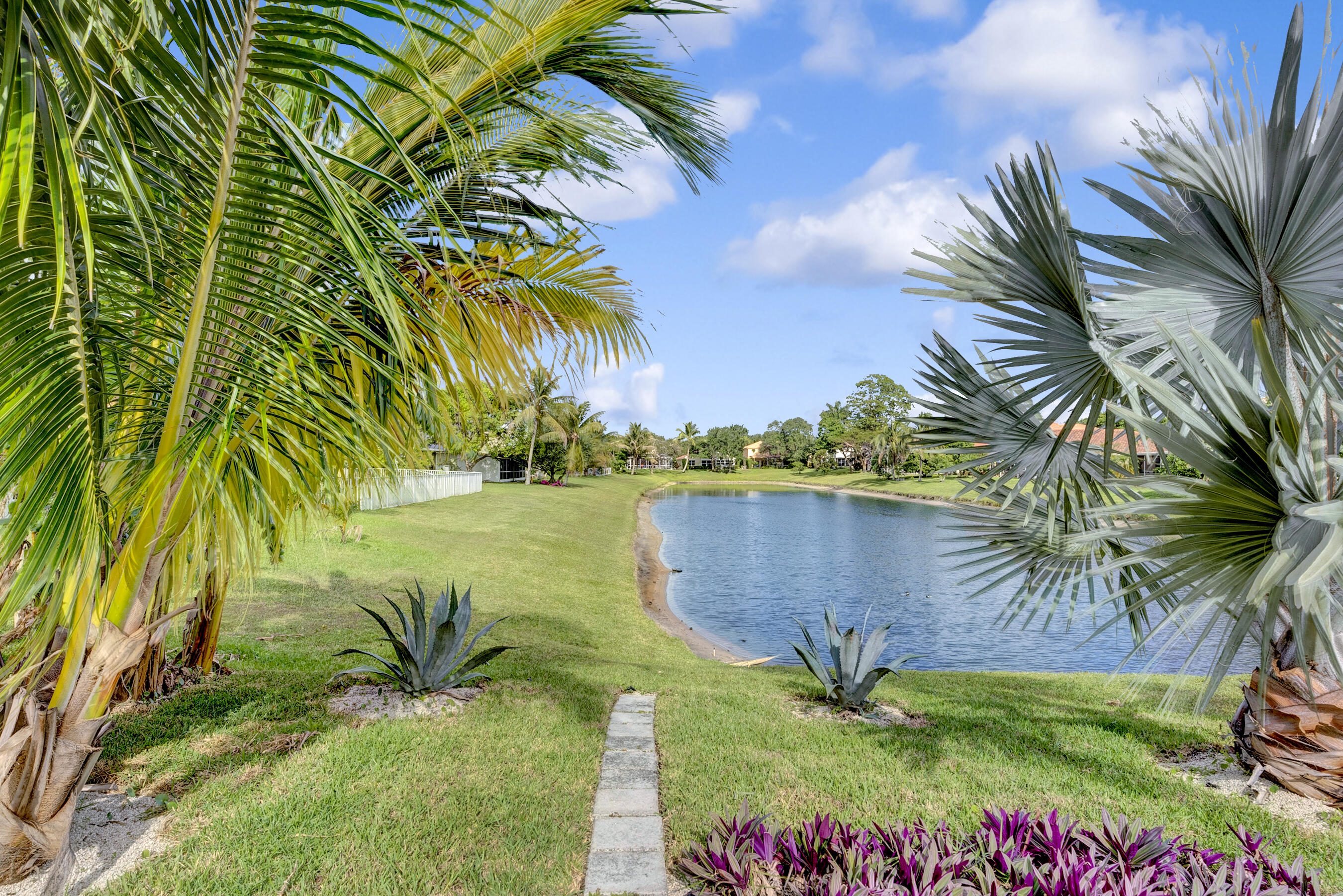 1175 Sea Grape Circle Delray Beach, FL 33445 - Photo 37 of 42 a view of a lake with a yard