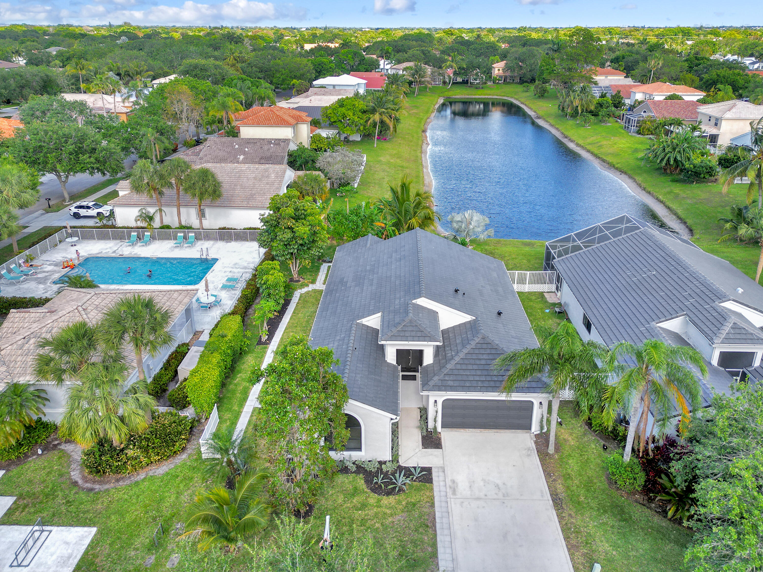 1175 Sea Grape Circle Delray Beach, FL 33445 - Photo 39 of 42 an aerial view of a house with a garden and lake view