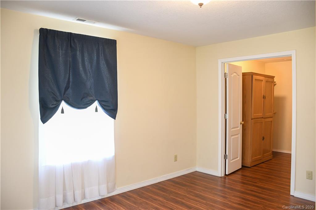 621 Incinerator Road Clyde, NC 28721 - Photo 11 of 27 a view of front door with wooden floor