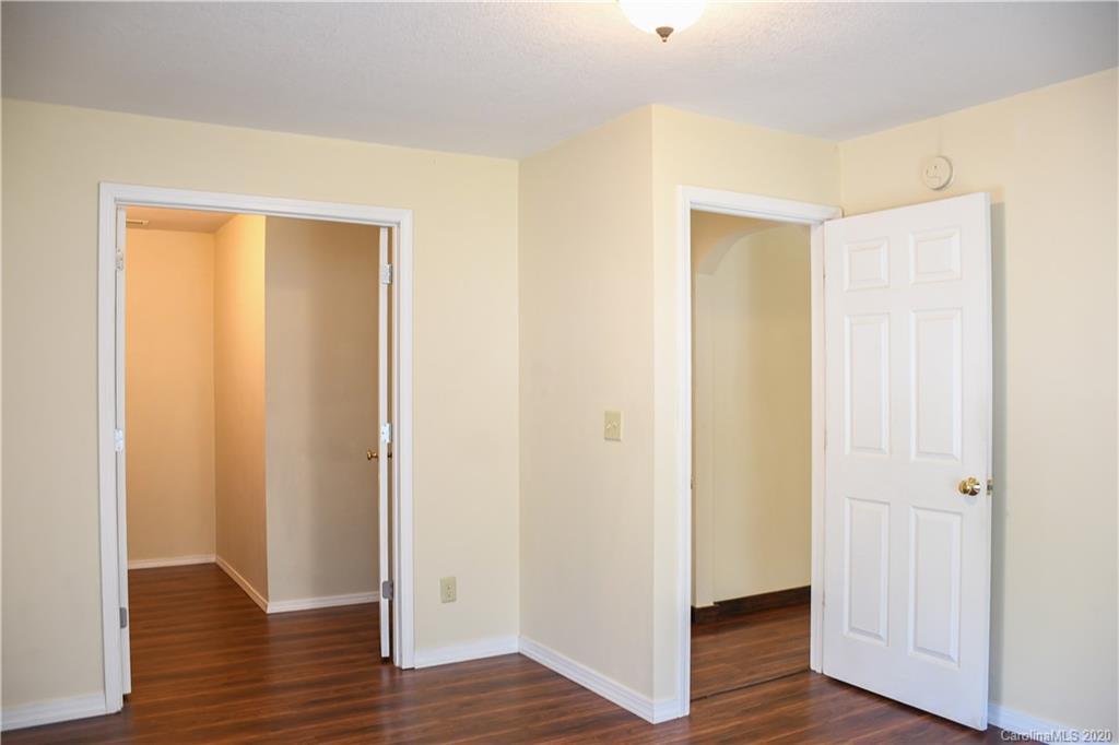 621 Incinerator Road Clyde, NC 28721 - Photo 12 of 27 a view of a hallway with wooden floor