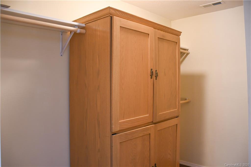 621 Incinerator Road Clyde, NC 28721 - Photo 13 of 27 a bathroom with a shower and a wooden door
