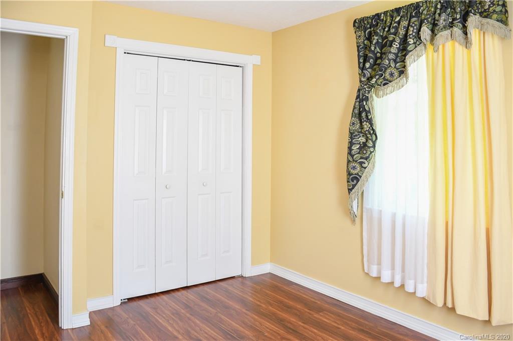 621 Incinerator Road Clyde, NC 28721 - Photo 18 of 27 a view of a small space with wooden floor and a window