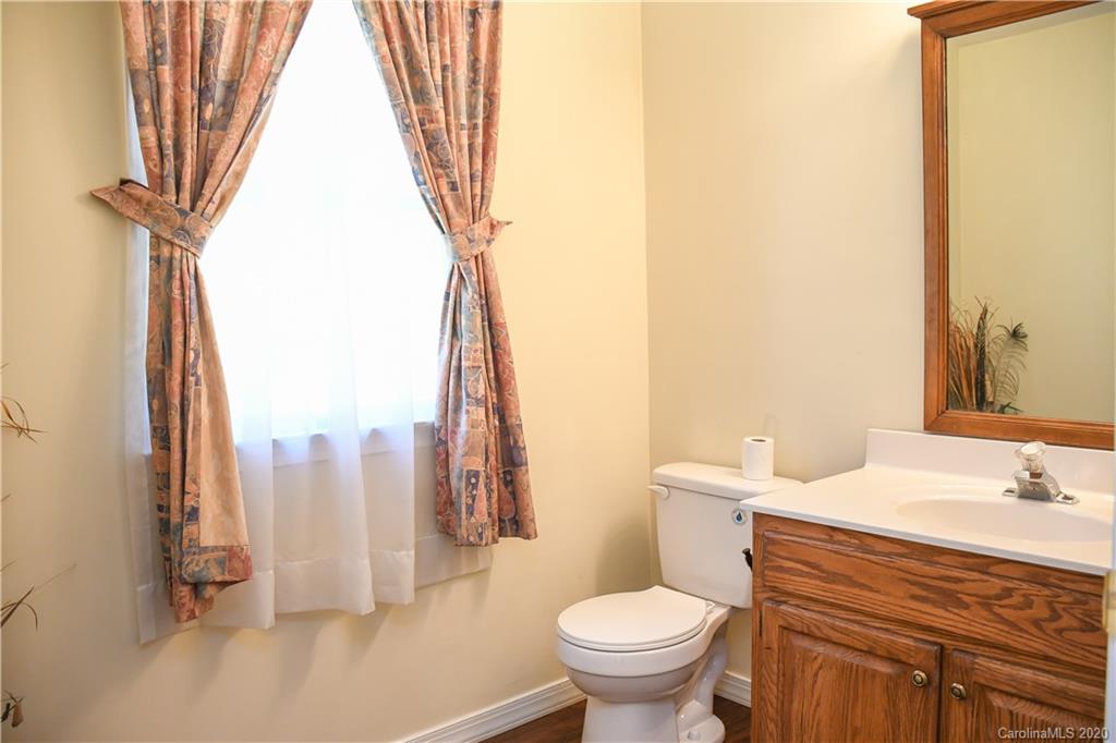621 Incinerator Road Clyde, NC 28721 - Photo 19 of 27 a bathroom with a sink toilet and shower