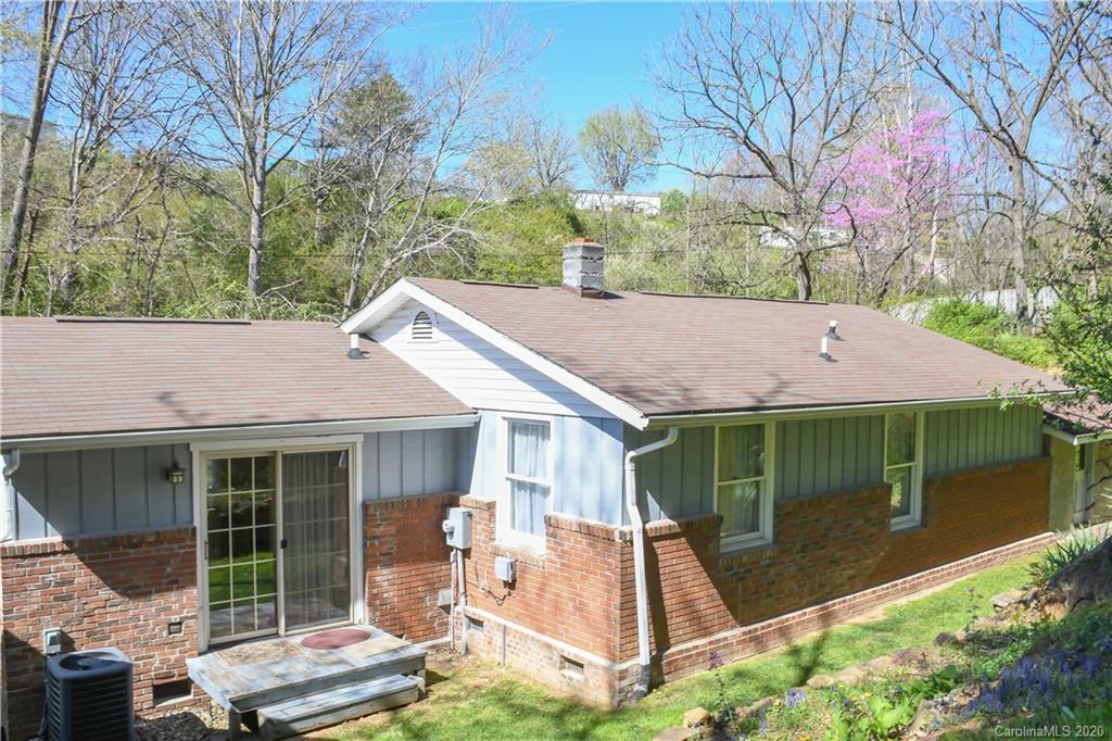 621 Incinerator Road Clyde, NC 28721 - Photo 22 of 27 a view of a house with a yard and sitting area