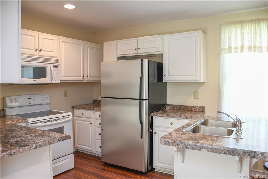 621 Incinerator Road Clyde, NC 28721 - Photo 5 of 27 a kitchen with a sink stove and refrigerator