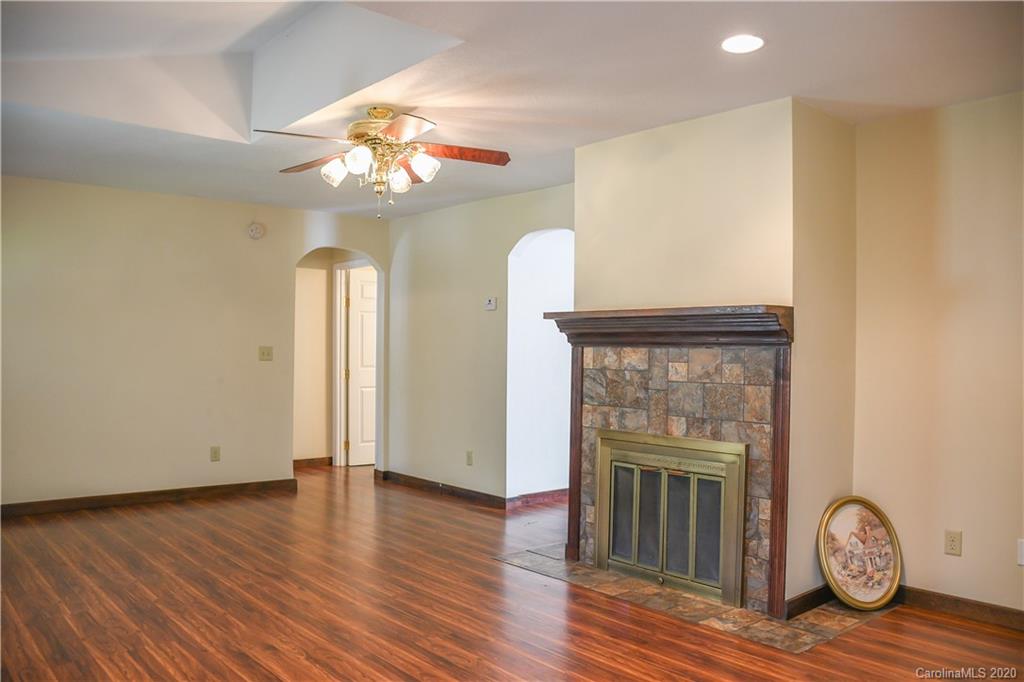 621 Incinerator Road Clyde, NC 28721 - Photo 8 of 27 a view of a livingroom with wooden floor