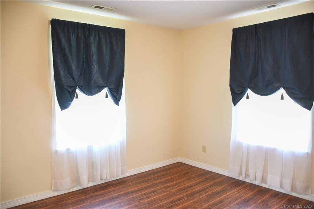 621 Incinerator Road Clyde, NC 28721 - Photo 10 of 27 a view of a closet area with wooden floor