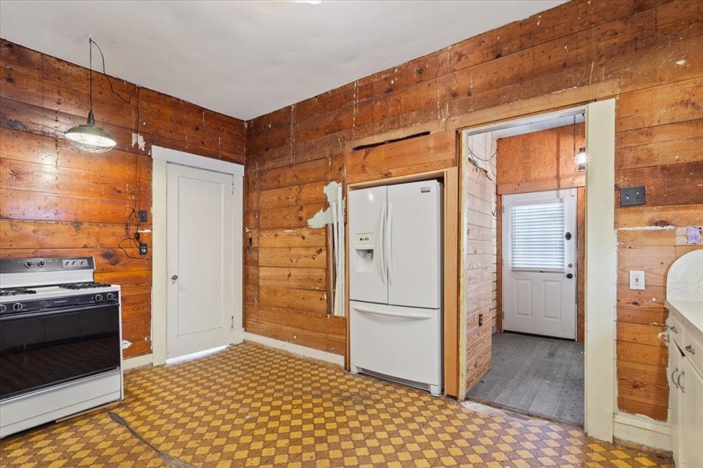 2600 Colcord Avenue Waco, TX 76707 - Photo 12 of 37 a kitchen with a refrigerator and a stove