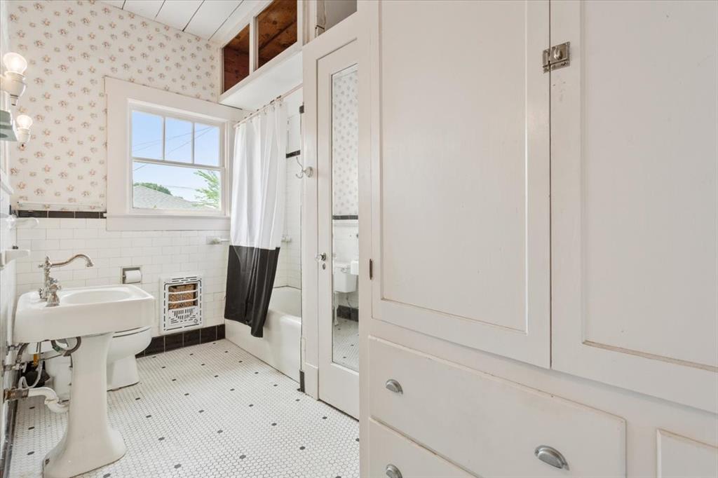 2600 Colcord Avenue Waco, TX 76707 - Photo 23 of 37 a bathroom with a sink toilet and shower