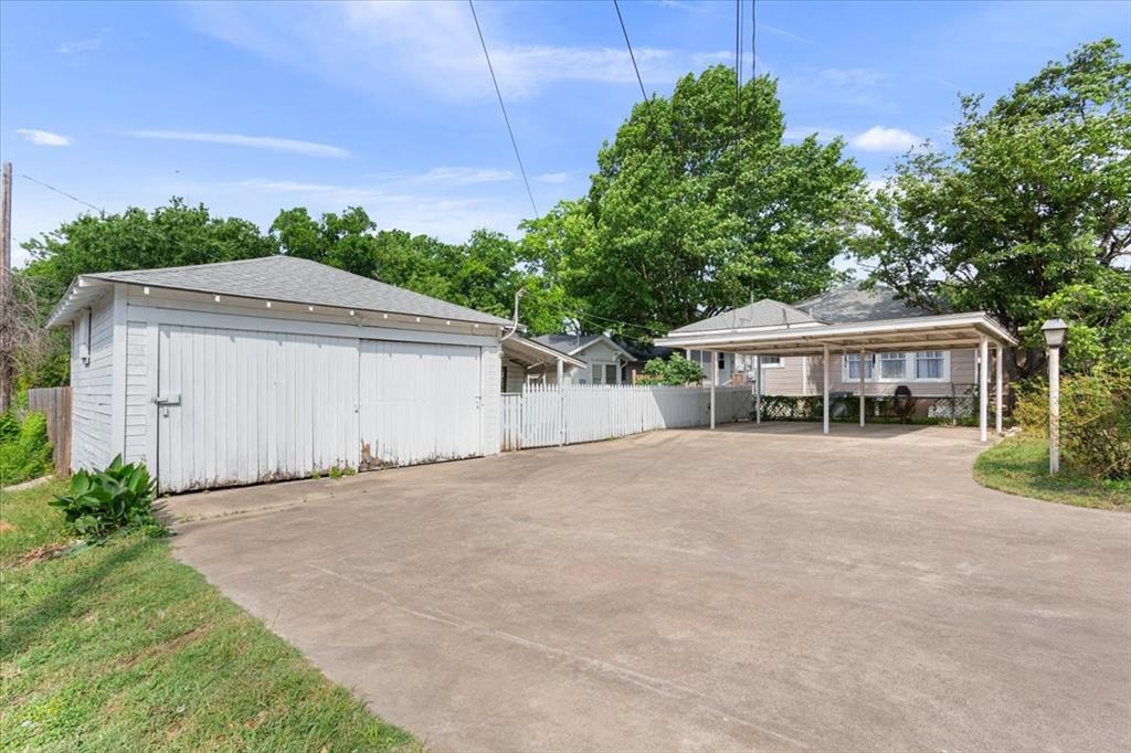 2600 Colcord Avenue Waco, TX 76707 - Photo 32 of 37 a front view of a house with a garden and trees