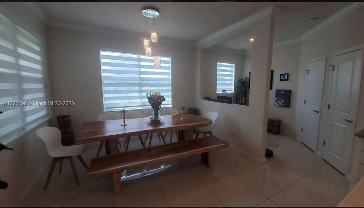Hillcrest Hollywood, FL 33021 - Photo 13 of 30 a living room with furniture and a window