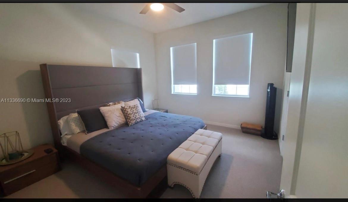 Hillcrest Hollywood, FL 33021 - Photo 15 of 30 a bedroom with a bed and a couch