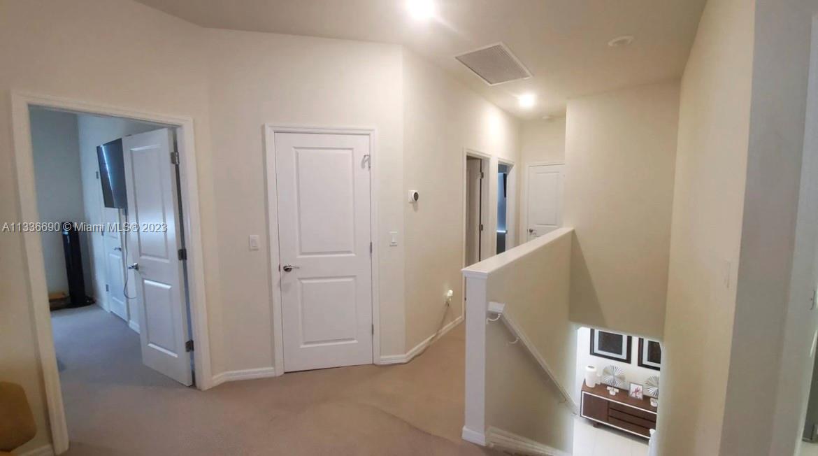 Hillcrest Hollywood, FL 33021 - Photo 16 of 30 a view of a hallway with closet and bathroom