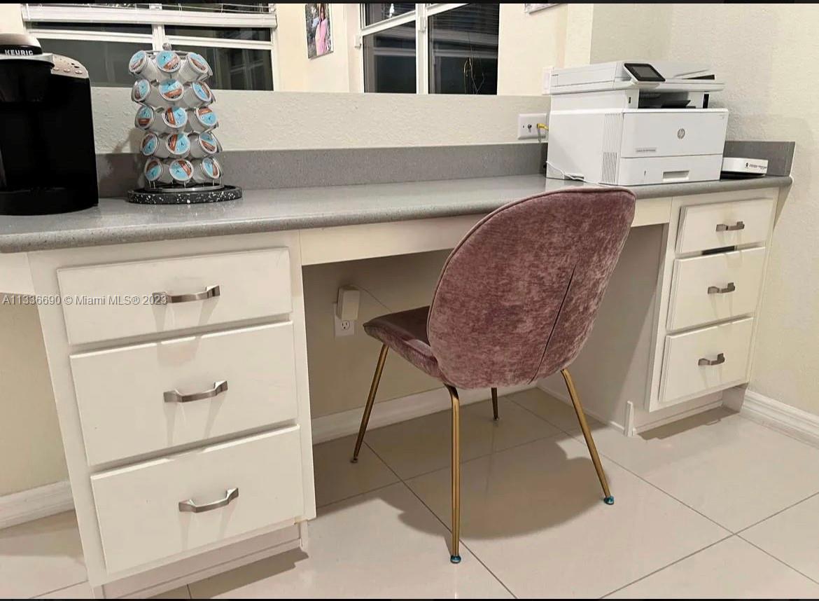 Hillcrest Hollywood, FL 33021 - Photo 27 of 30 a kitchen with a refrigerator and cabinets