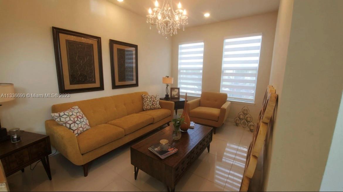 Hillcrest Hollywood, FL 33021 - Photo 3 of 30 a living room with furniture and a large window