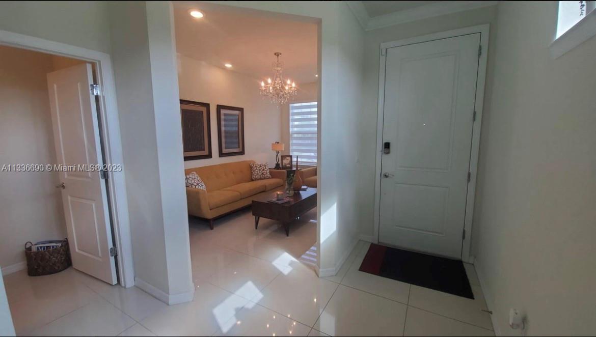 Hillcrest Hollywood, FL 33021 - Photo 4 of 30 a living room with furniture and a walk in closet