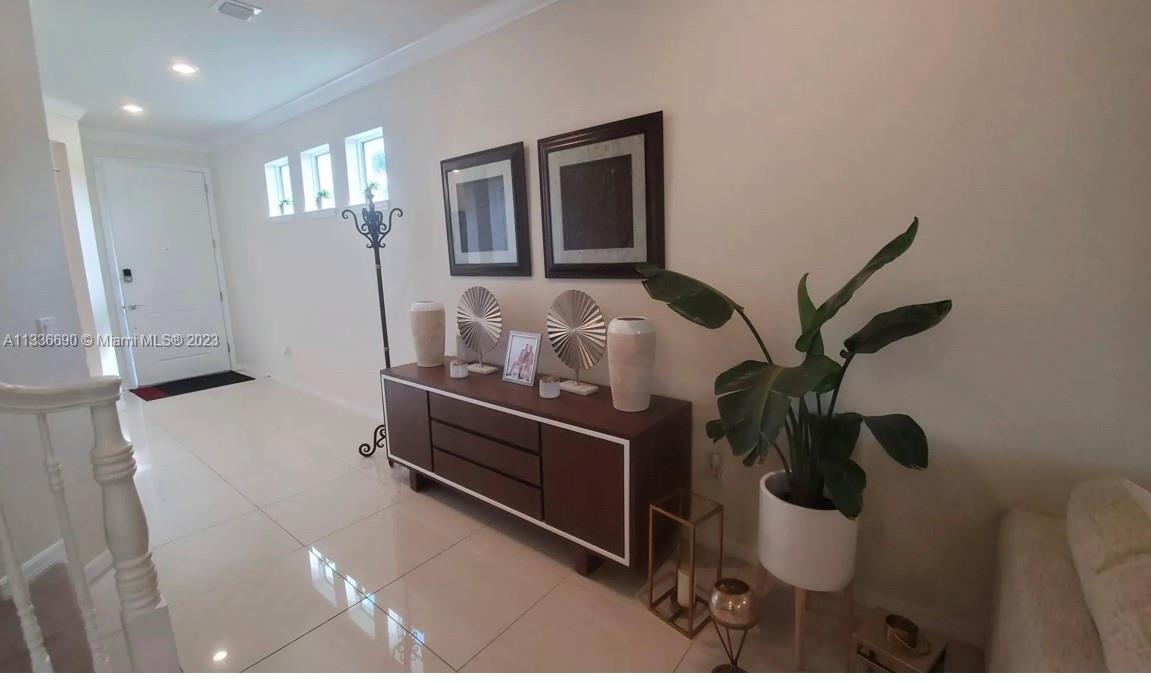 Hillcrest Hollywood, FL 33021 - Photo 5 of 30 a room with a table chairs and entryway