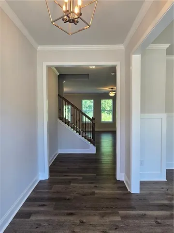a view of entryway and hall with wooden floor