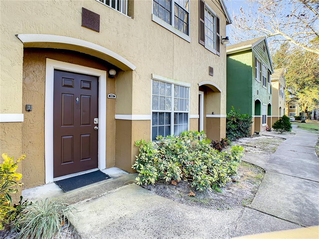 4316 South Kirkman Road, Unit 1613 Orlando, FL 32811 - Photo 1 of 1 a front view of a house with a yard