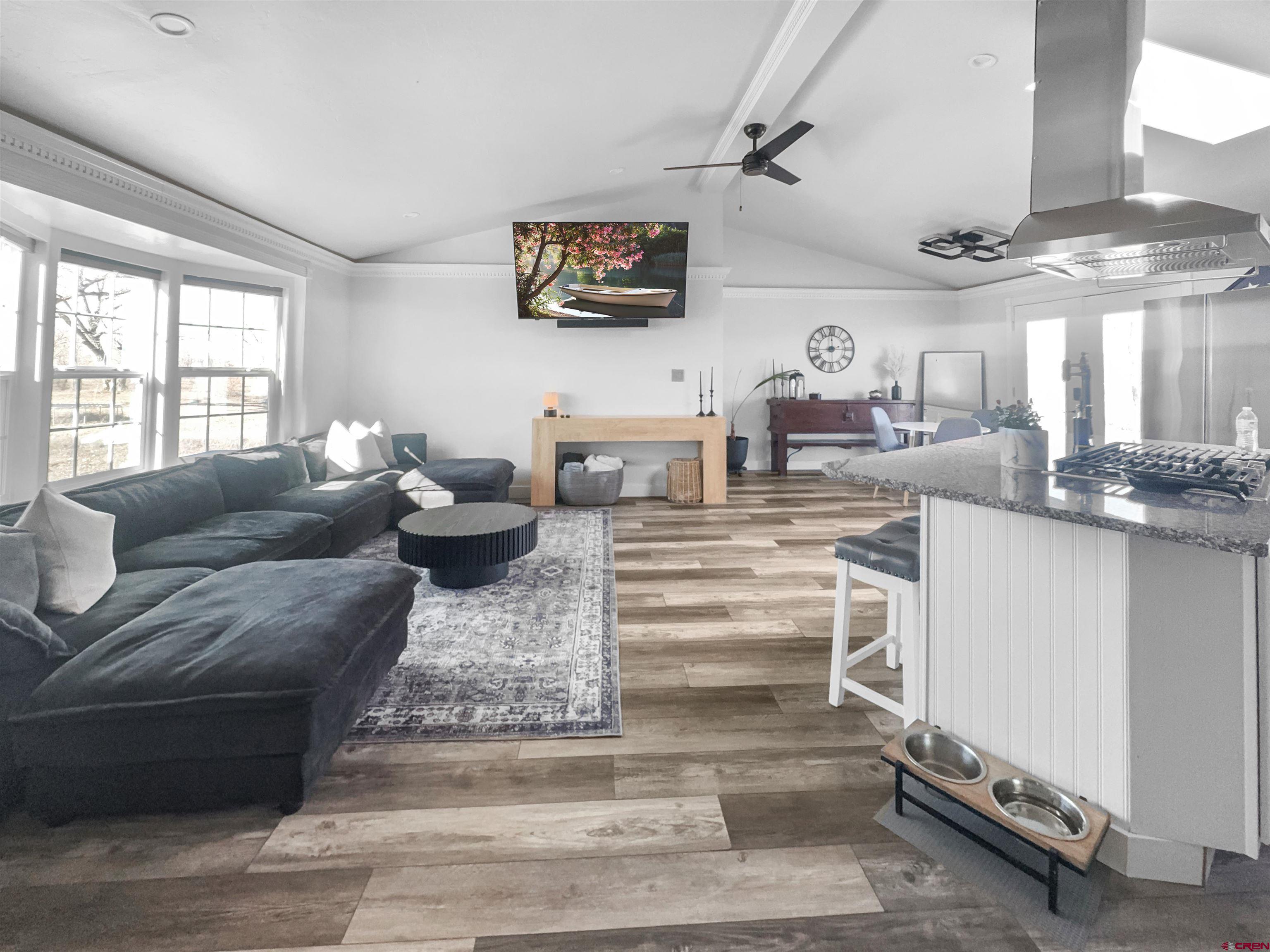 10880 Road 26 Cortez, CO 81321 - Photo 22 of 43 a living room with furniture and a flat screen tv