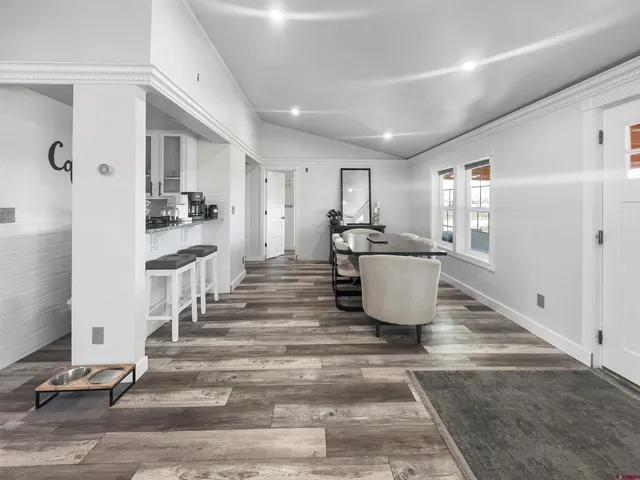 a living room with a furniture and a rug