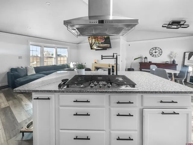 a kitchen with a stove and cabinets