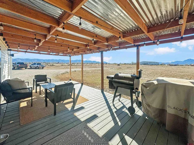 a view of a balcony with wooden floor