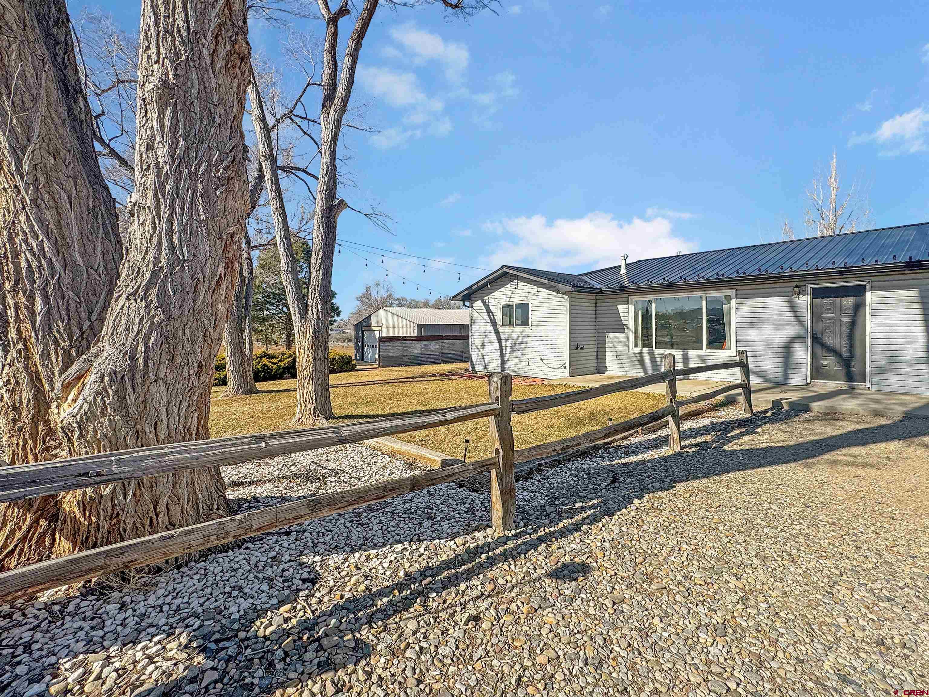 10880 Road 26 Cortez, CO 81321 - Photo 5 of 43 a view of a house with wooden fence