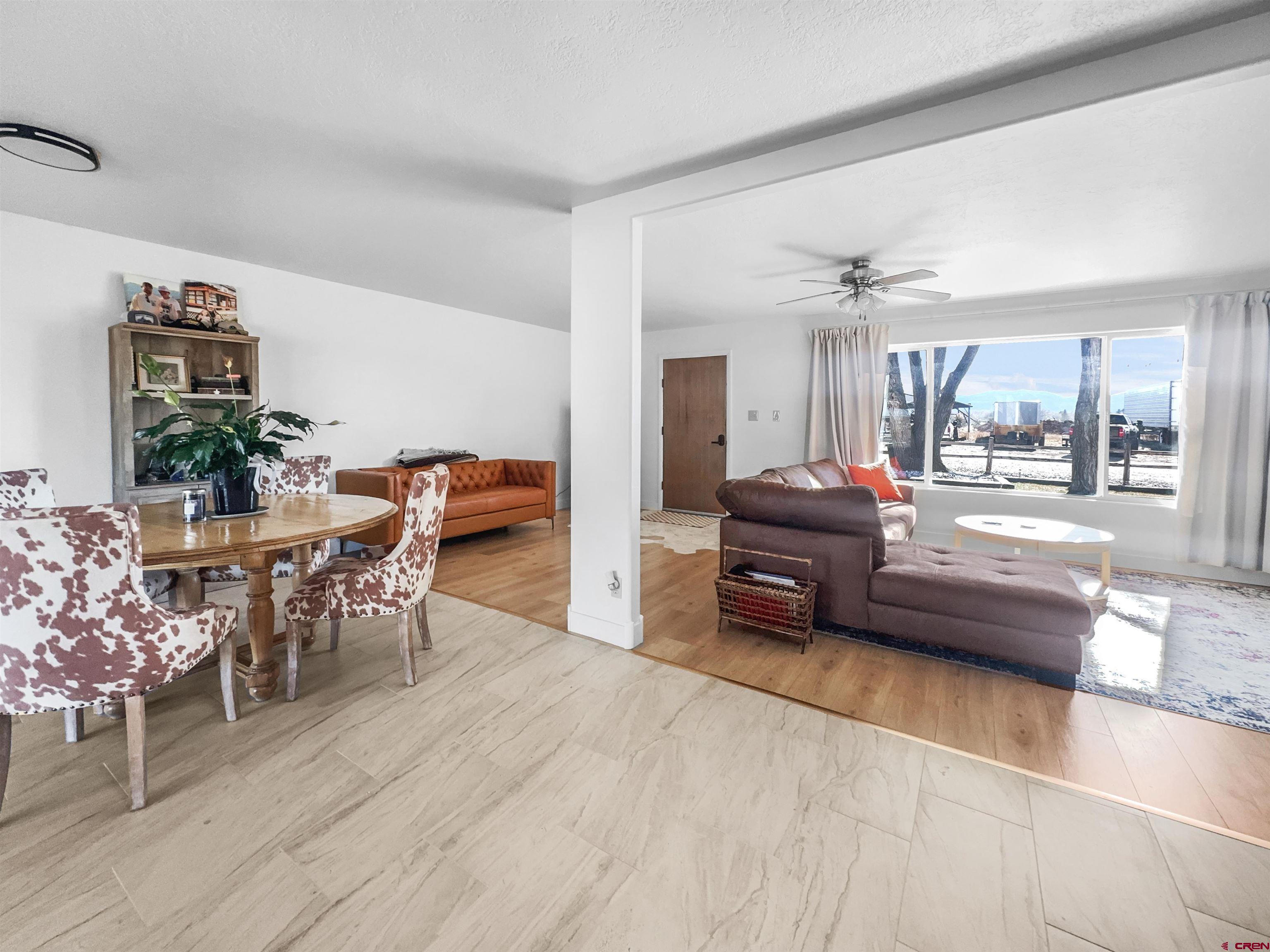 10880 Road 26 Cortez, CO 81321 - Photo 7 of 43 a living room with furniture and wooden floor