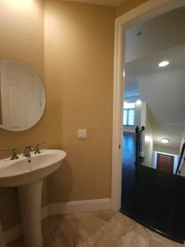 a bathroom with a sink and a mirror