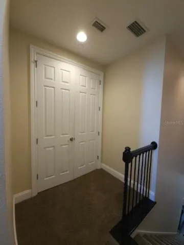 an empty room with a wooden door