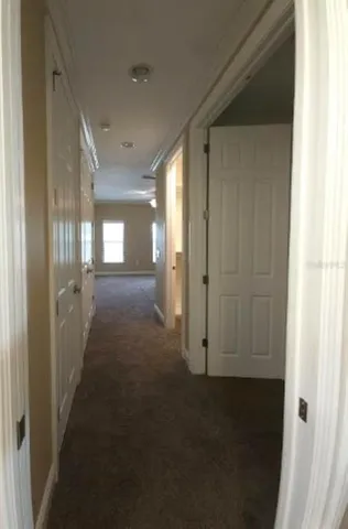 a view of hallway with livingroom
