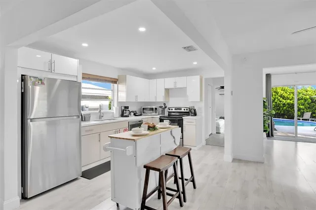 a living room with furniture and white walls