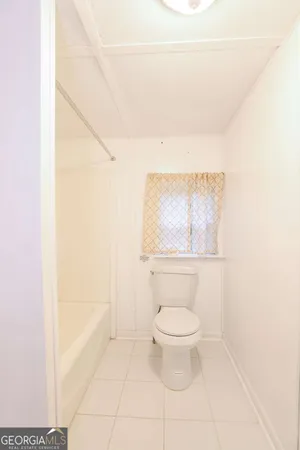 a bathroom with a toilet and a vanity