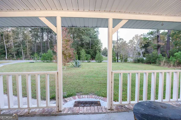 a view of a porch with a yard