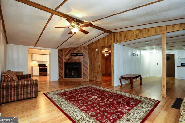 a living room with furniture rug and window
