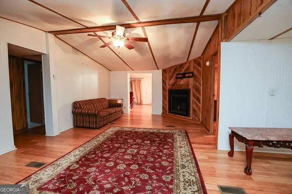a living room with a couch and a rug