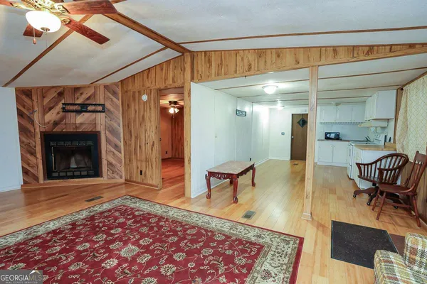 a view of a livingroom with furniture and a fireplace